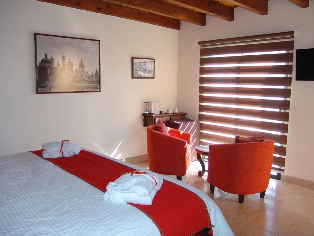 Casa Del Tio Hotel Boutique سان ميغيل دي الليندي الغرفة الصورة A room at the hotel