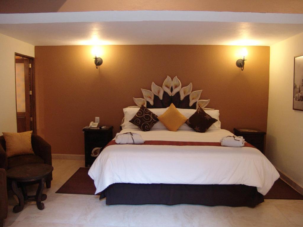 Casa Del Tio Hotel Boutique سان ميغيل دي الليندي الغرفة الصورة A room at the hotel