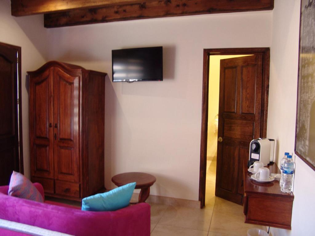 Casa Del Tio Hotel Boutique سان ميغيل دي الليندي الغرفة الصورة A room at the hotel