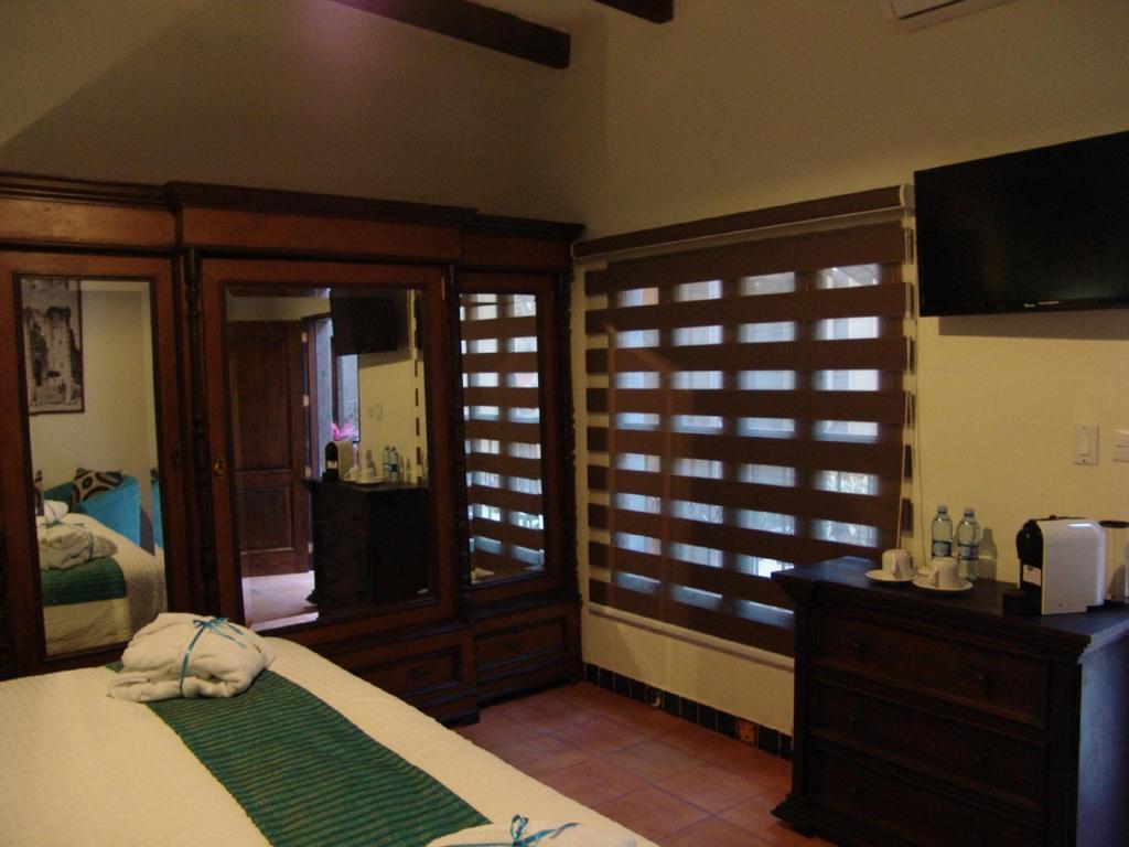 Casa Del Tio Hotel Boutique سان ميغيل دي الليندي الغرفة الصورة A room at the resort